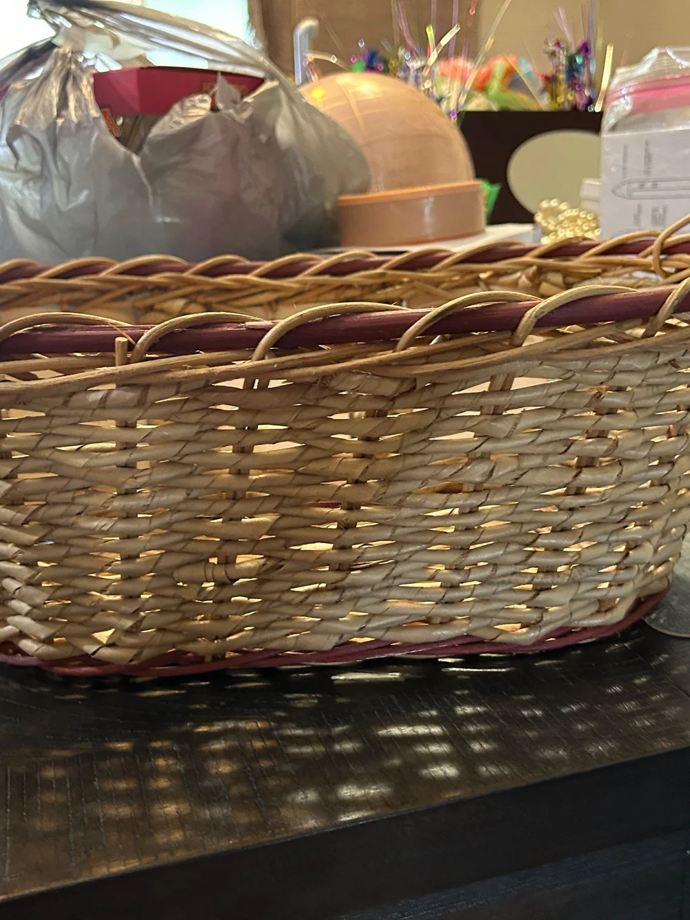 vintage woven wicker basket features hand-painted ceramic fruit tiles.